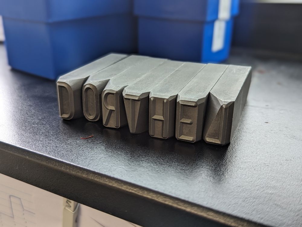 Embossing letters lined up to the word "Dorthel"