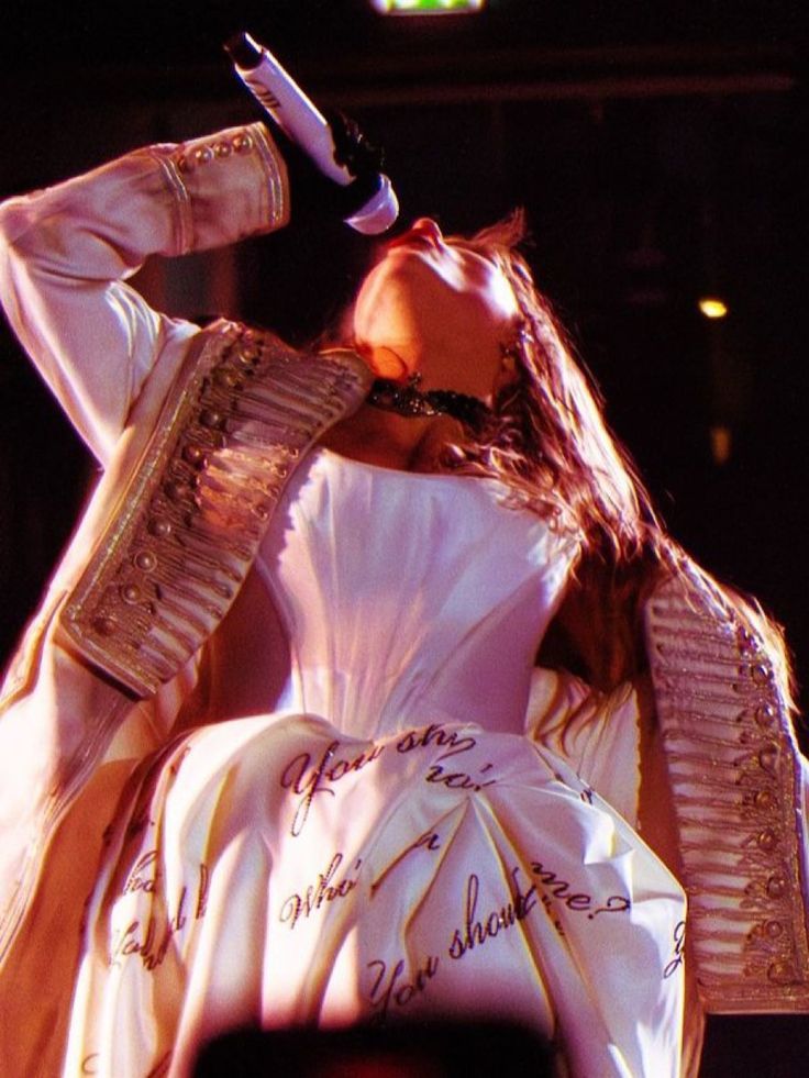 taylor swift on stage at the eras tour during ttpd era