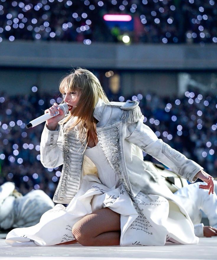 taylor swift on stage at the eras tour during ttpd era