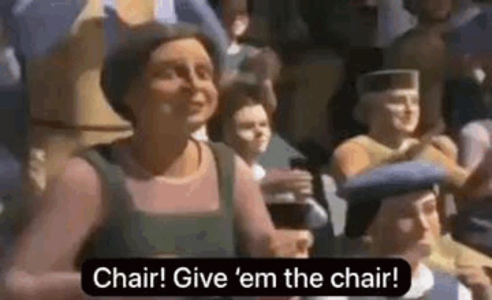 a woman is standing in a crowd of people and saying `` chair ! give 'em the chair ! ''