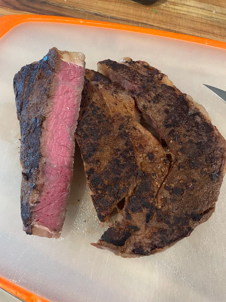 Cooked wagyu ribeye sliced to show doneness