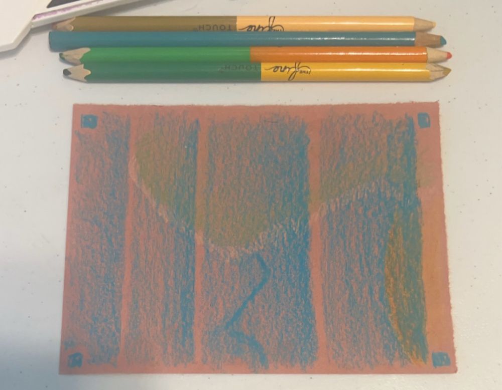 Art piece on a 4.5” x 6” pieces of light brown construction paper. Blue colored pencil is shaded in four vertical bands across the field, each growing darker from left to right and each band wider than the one before it. Underneath the blue are abstract waves of white and green traveling horizontally across the field with a darker ribbon of blue traveling vertically From the center of the piece downward. Tucked into the left corner underneath the blue bands is a semi circle of orange and yellow, being eclipsed by the thickest blue band save for a small sliver of yellow. 
