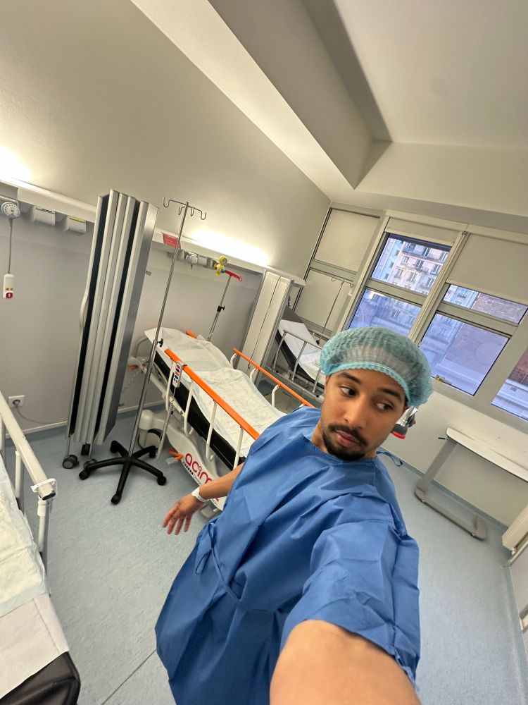 0.5 selfie of me in a hospital gown in a hospital room 