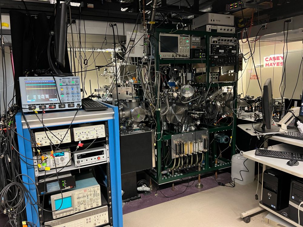 An engineering lab filled with computers and other electronics, with lots of wires connecting the devices.