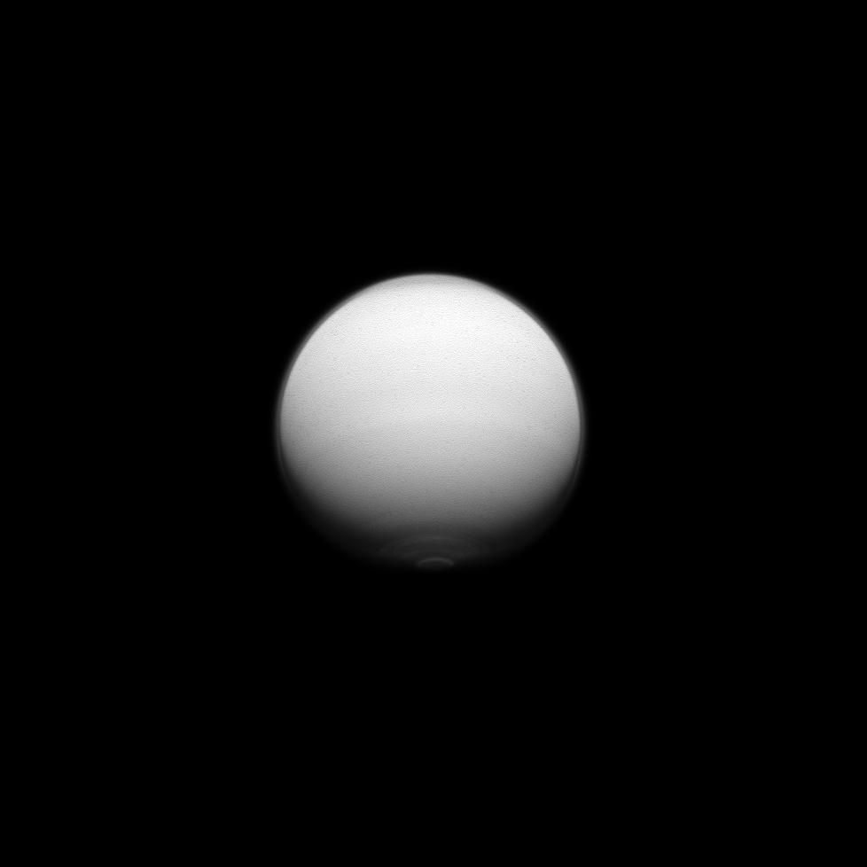 Titan, monochrome (violet light), polar hood visible.