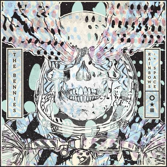 Album art of a skull in a space suit shooting rainbows from its eyes 