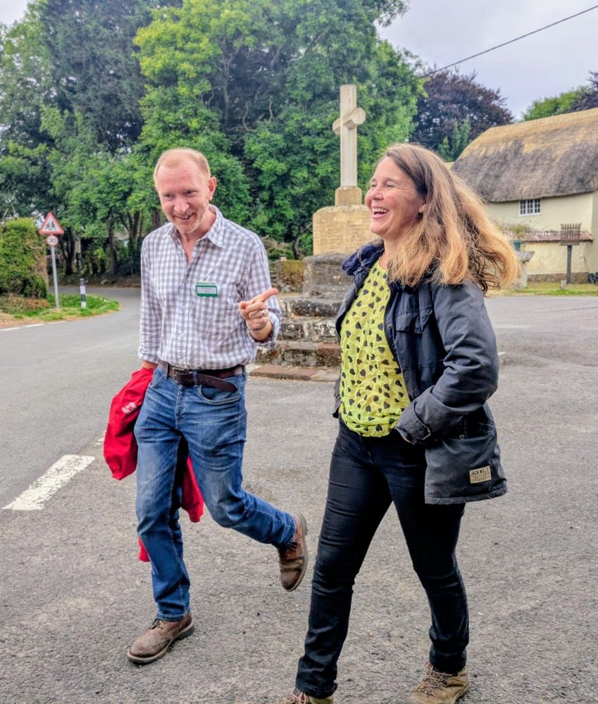 Vikki  walking in Shapwick with a National Trust staff member 