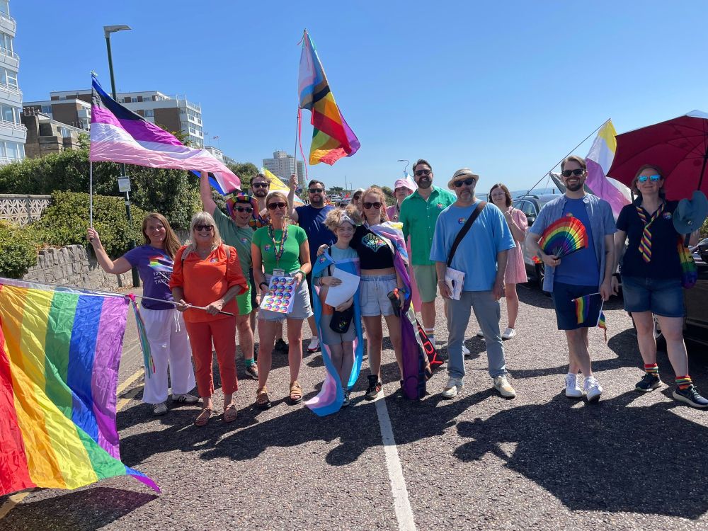 Members of the BCP Council staff & cllrs at the start of the pride parade complete with flags  