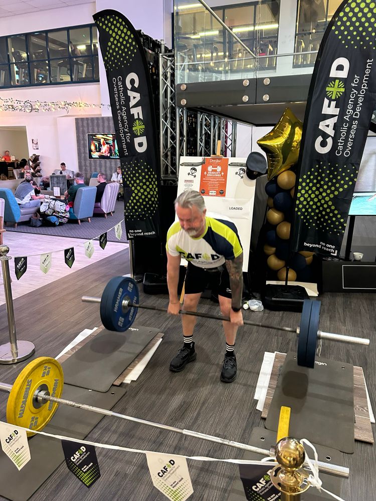 Organiser and CAFOD member lifting one of his tonnes 