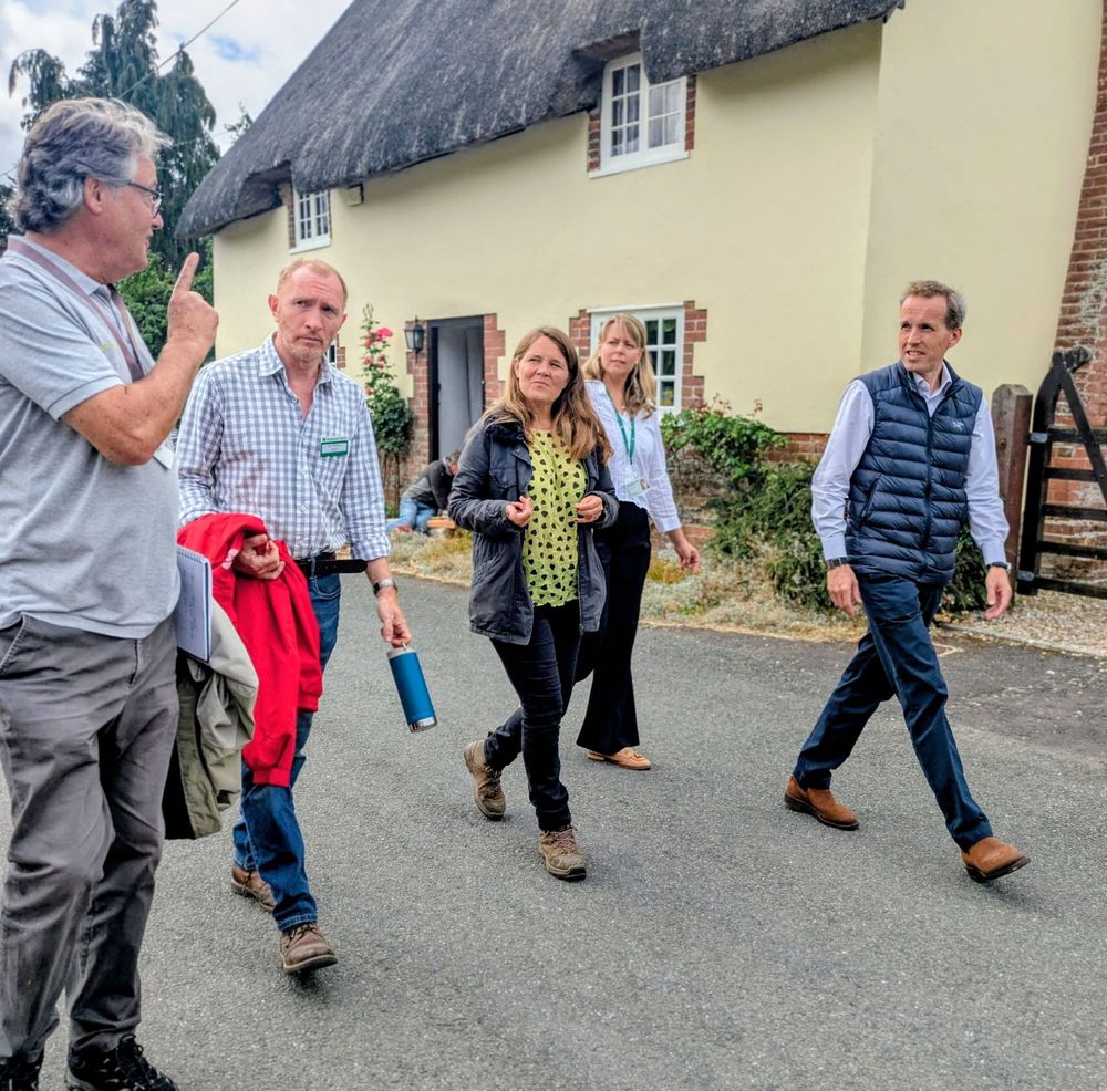 Vikki in Shapwick walking with National Trust staff members 