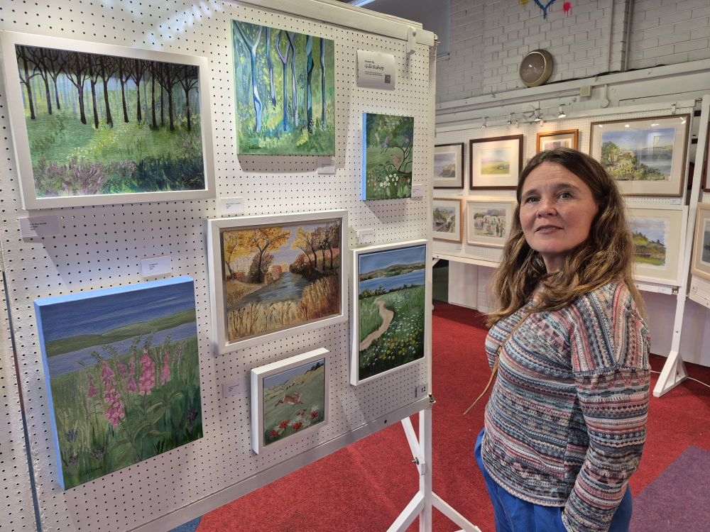 Vikki looking at art work 