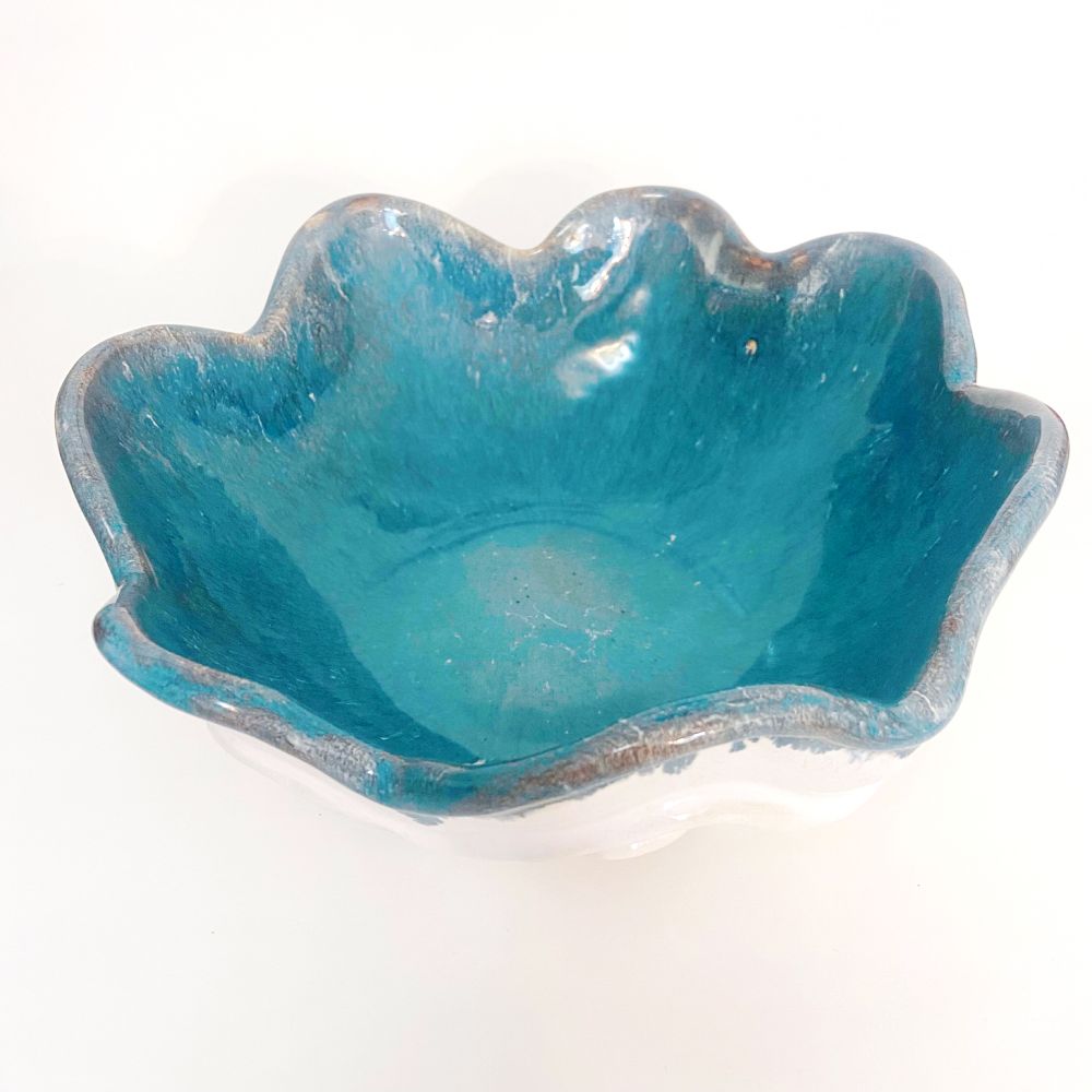 Photo looking down into the bowl, showing the blue glaze on the inside.