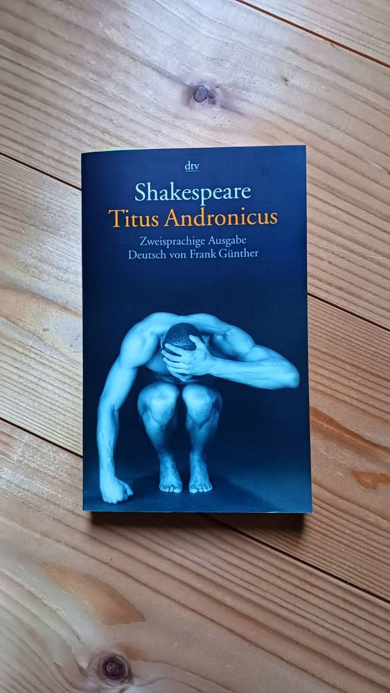 book on wooden floor - Shakespeare's Titus Andronicus