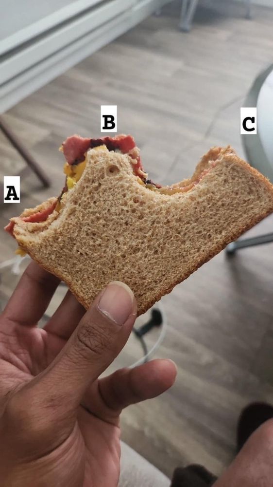 A loaf of breed bit at three different places