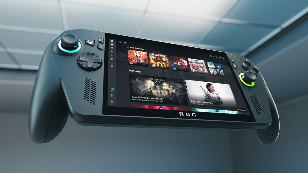 A handheld gaming console (the newly announced ROG Xbox Ally X) with a screen displaying a user interface featuring game thumbnails under 'Playing Now' and 'Featured' sections. The console includes two joysticks, directional buttons on the left, and action buttons on the right.