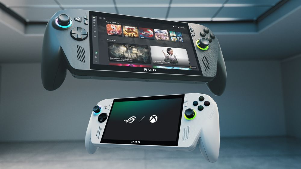 Two handheld gaming devices are shown in a modern, minimalistic room. The top device is black with a screen displaying various game titles such as 'Jump King,' 'Dead Cells,' and 'Stardew Valley.' The bottom device is white with a screen showing the logos of ROG (Republic of Gamers) and Xbox. Both devices have control buttons on either side of the screen, including joysticks and directional pads.