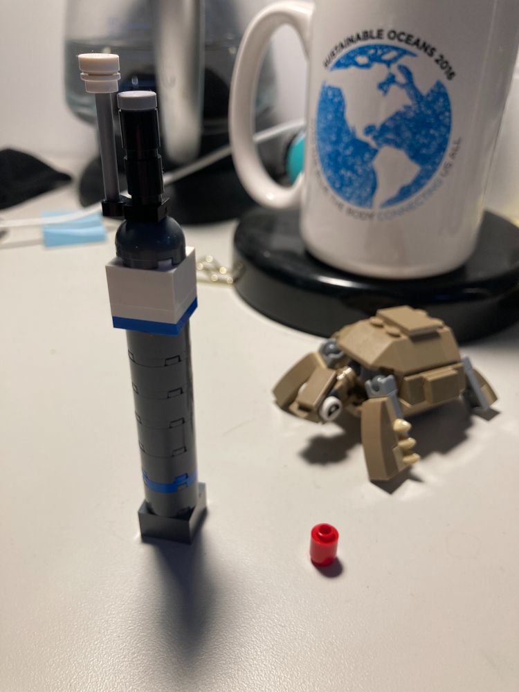 A lego Argo float with the traditional (black) sensor on the end cap (with a lego tortoise named Gus, who lives at the NS Museum of Natural History, looking on).