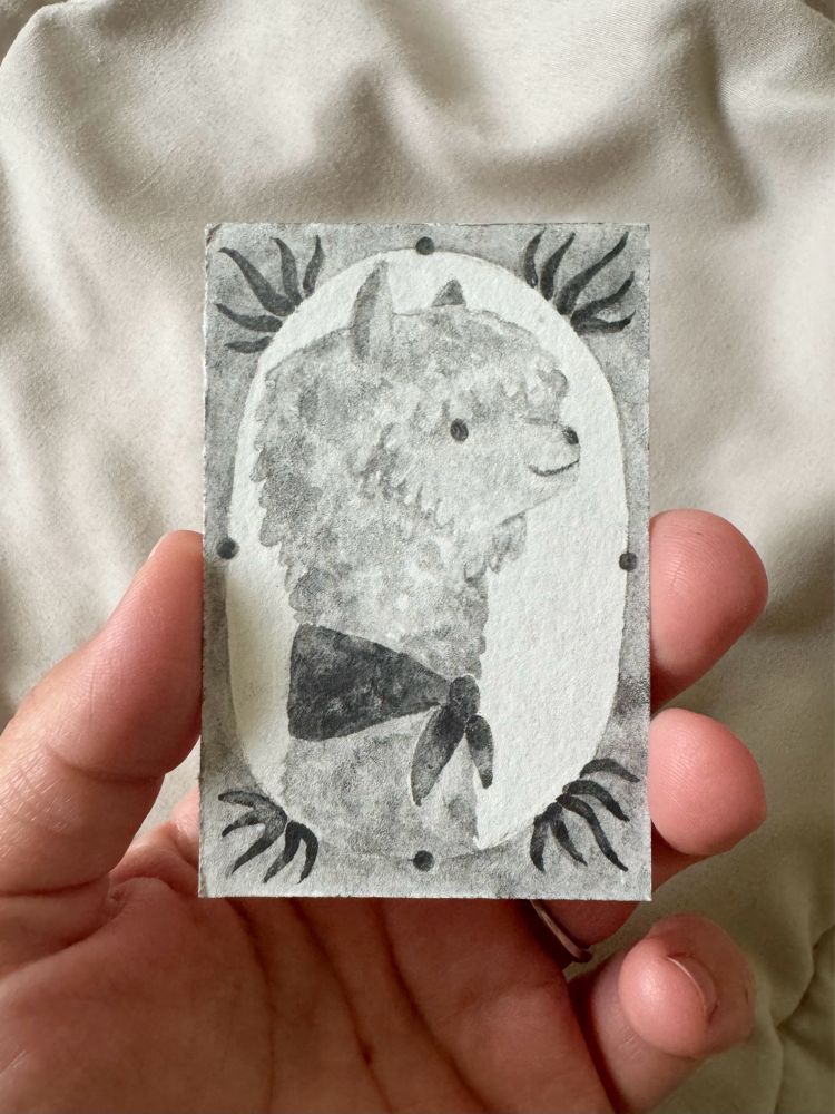A black and white, cameo-style painting of a llama wearing an ascot , done in water soluble graphite.