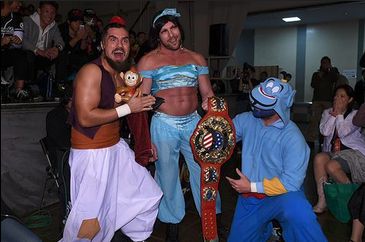 Several NJPW wrestlers in silly costumes as characters from Disney's Aladdin.