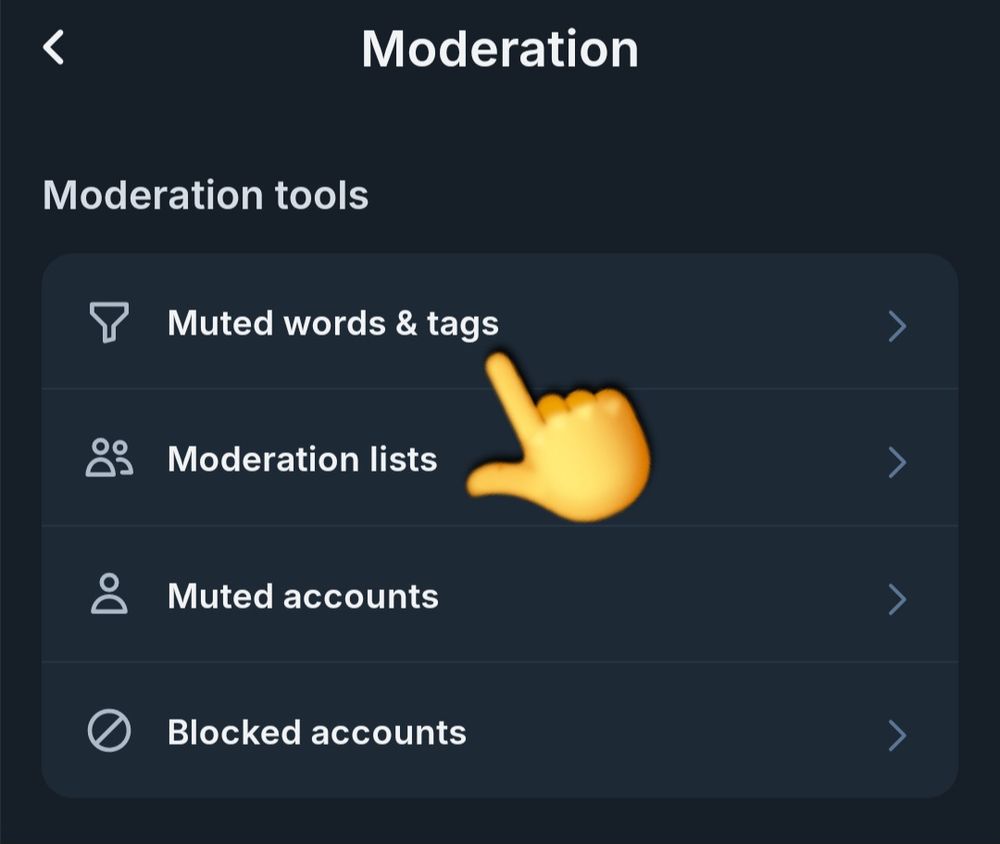 Screenshot of the Bluesky moderation settings, with a yellow emoji hand pointing to the 'muted words and tags' section