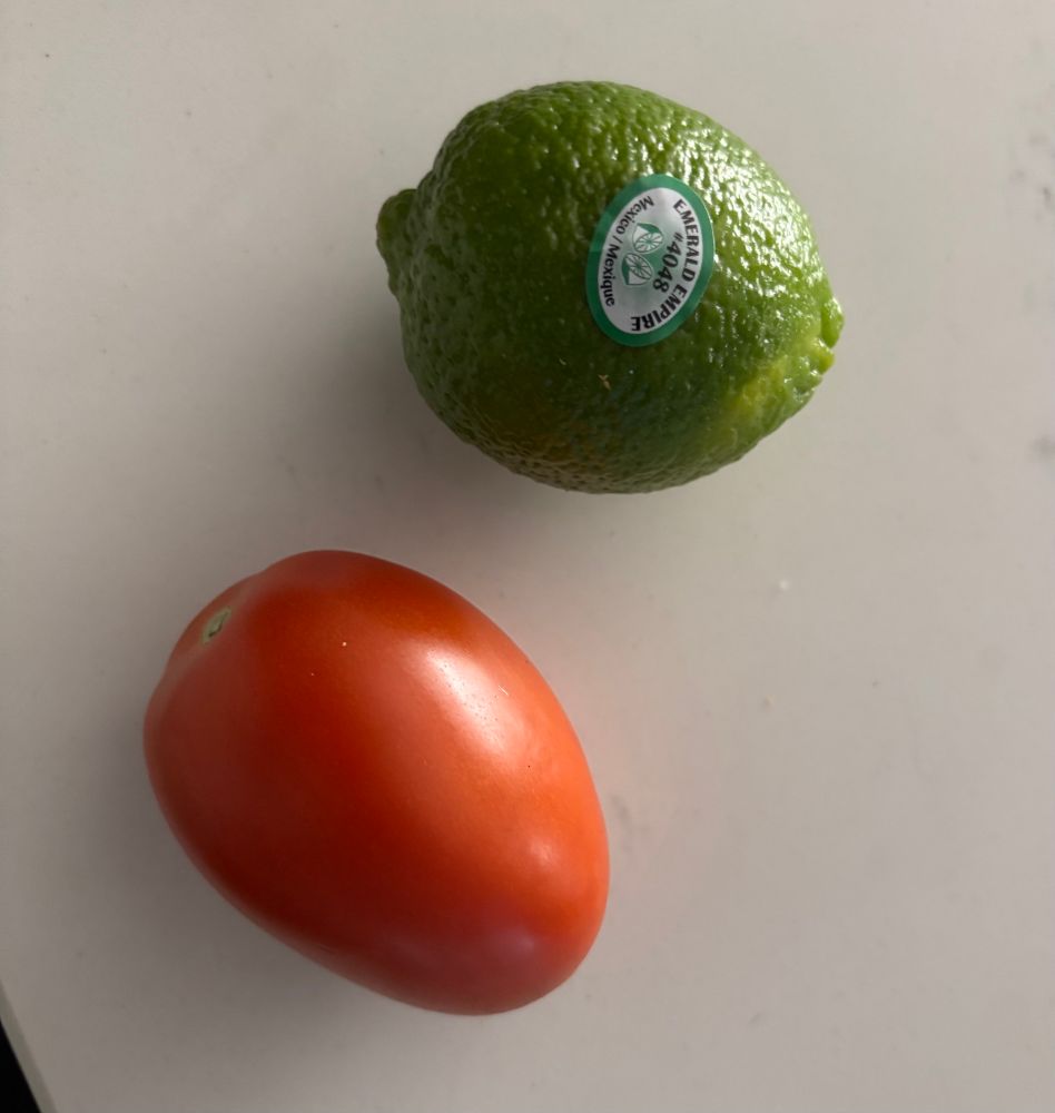 Picture of a lime and tomato. 
