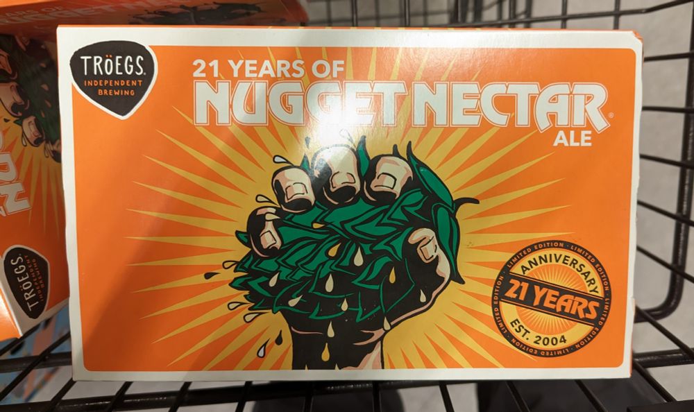 A six pack of Nugget Nectar beer.