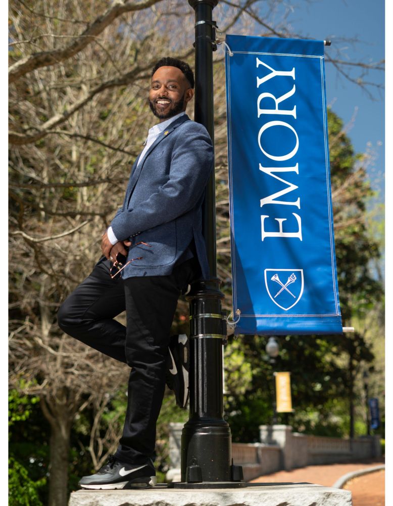 Neo with an Emory University sign