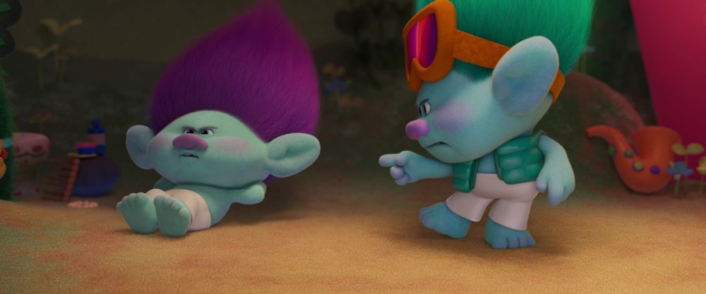 Young John Dory yelling at Bruce for encouragement while he does push ups. Bruce looks focused.