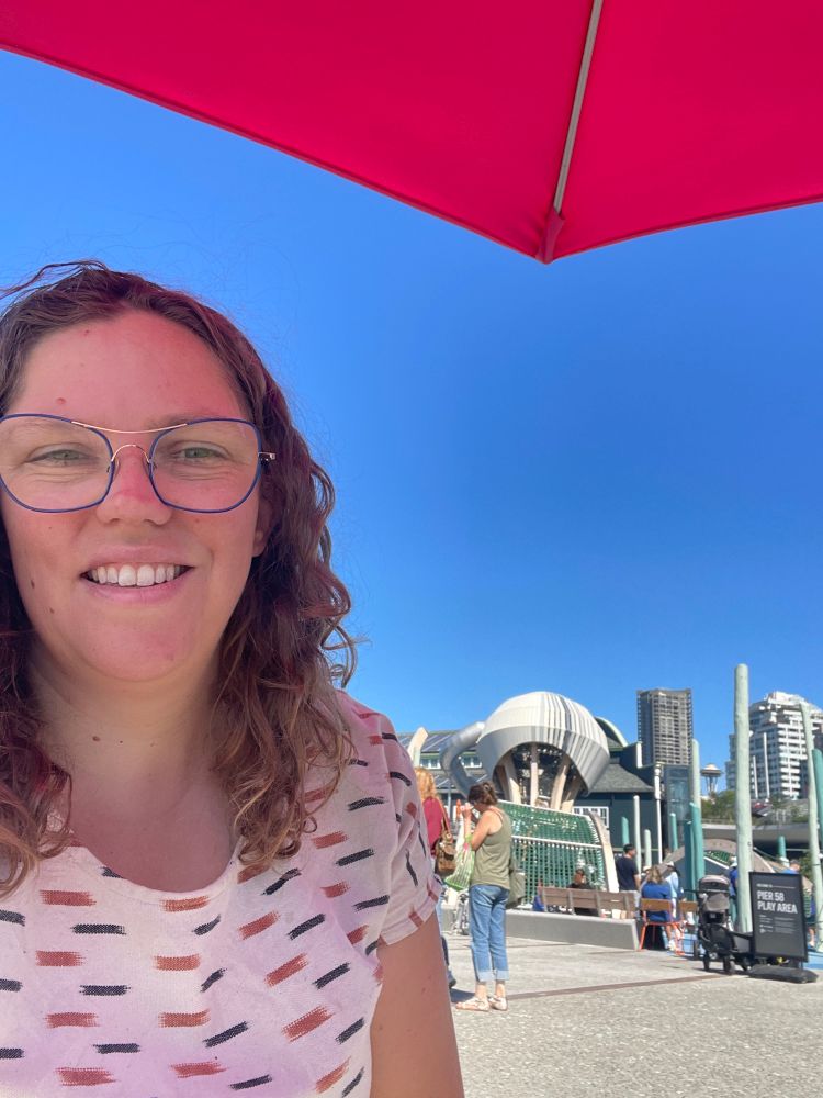 Me under an umbrella with the new pier 58 playground in the background 
