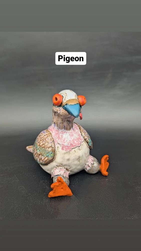 Ceramic pigeon with tongue out. 