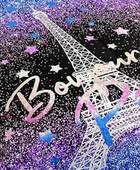 Bed comforter with white Eiffel Tower and the word Bonjour in pink and the word Paris cut off on a purple and blue starry background 