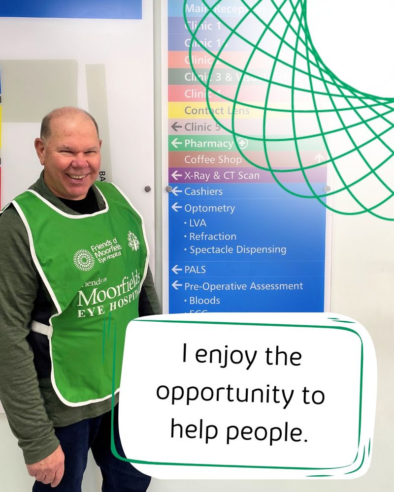Steve, a volunteer, smiles beside a sign pointing to locations around the hospital. A text bubble says: I enjoy the opportunity to help people.