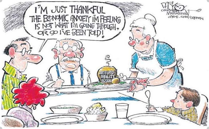 Family at Thanksgiving dinner with almost nothing to eat because of affordability issue.