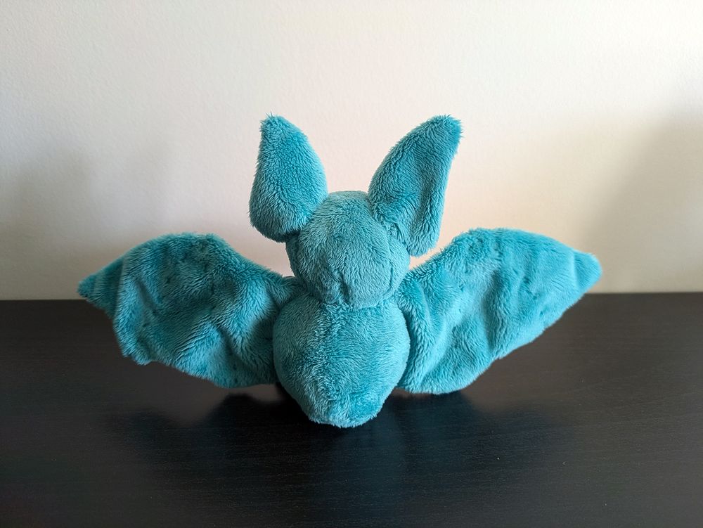 a photo of an hand sew plush of a bat - the pattern is from beezeeart