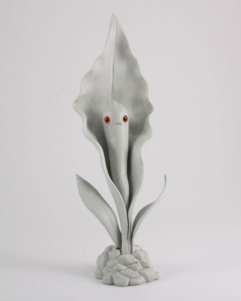 Photo of grey unpainted flowering plant creature sculpture by Andrew Bell