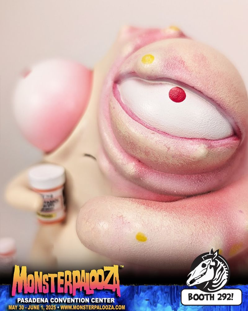 Close up photo of creature with bulging eyes, one side of it's body is swollen and gross, holding a pill bottle.
