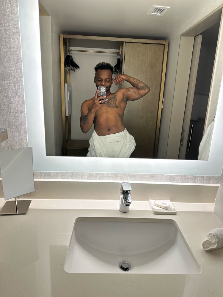 African American flexing in the mirror