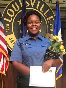 Lovely graduation picture of Breonna Taylor, a black woman, who was murdered in her home by LMPD