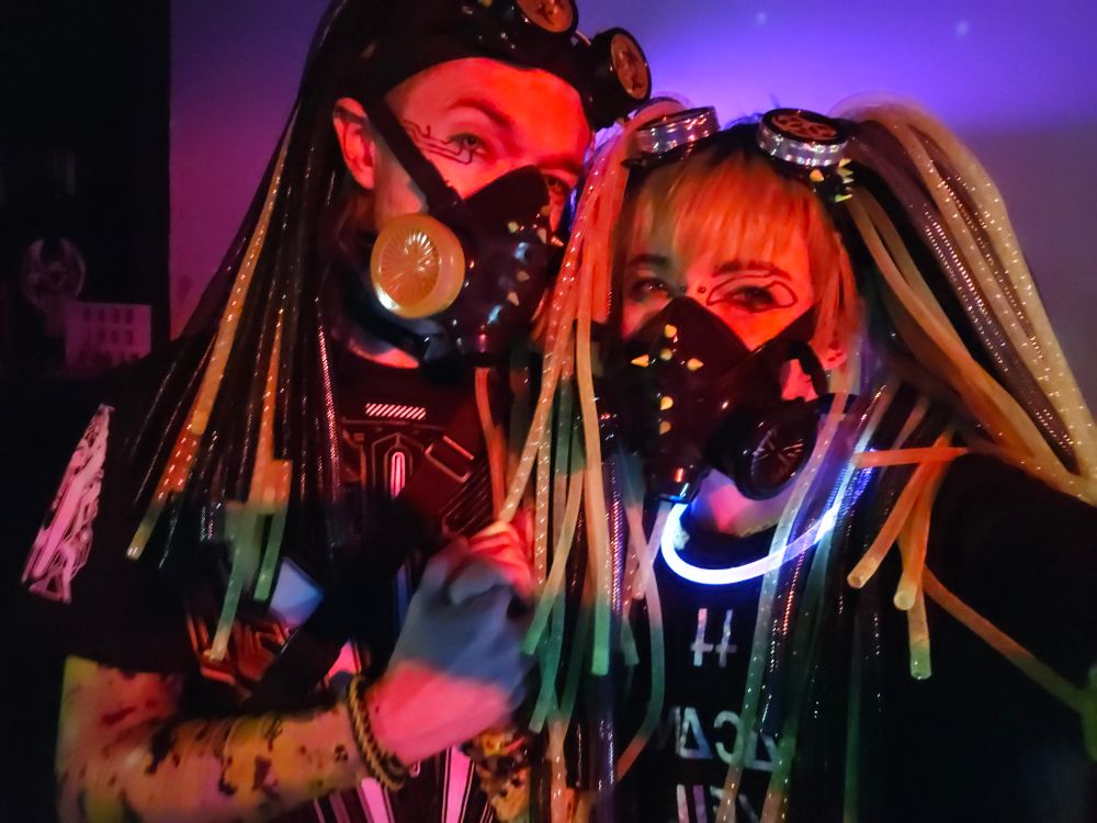two cybergoths in red lighting