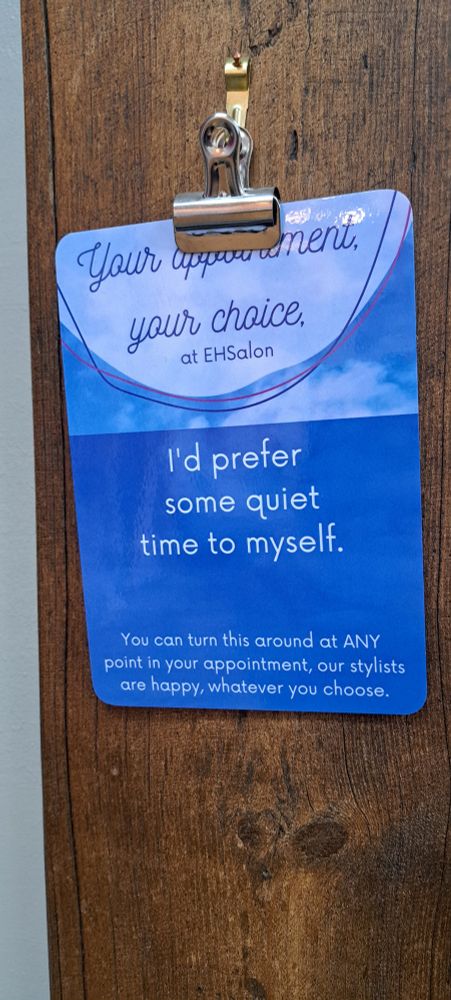 A 2 sided sign. One side says I'd prefer some quiet time to myself. The other says Ready to catch up and share stories. 