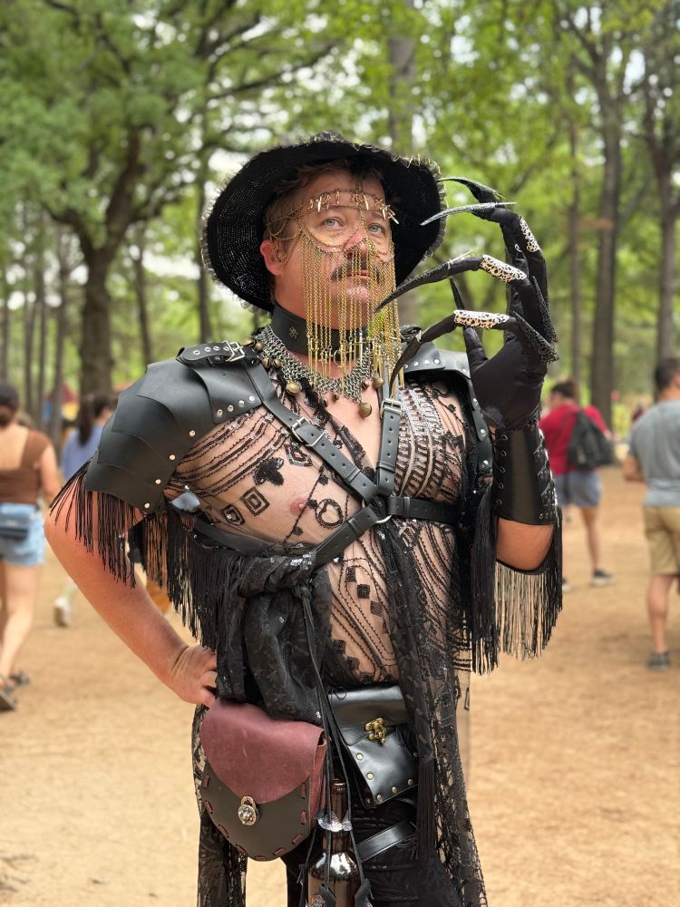 A reticulated claw gauntlet with a chain mask and overlapping sequins and leather