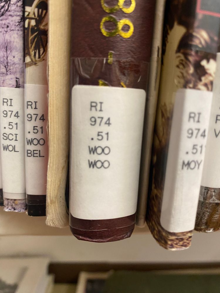Library book spine label. The call number reads “RI 974.51 WOO WOO”