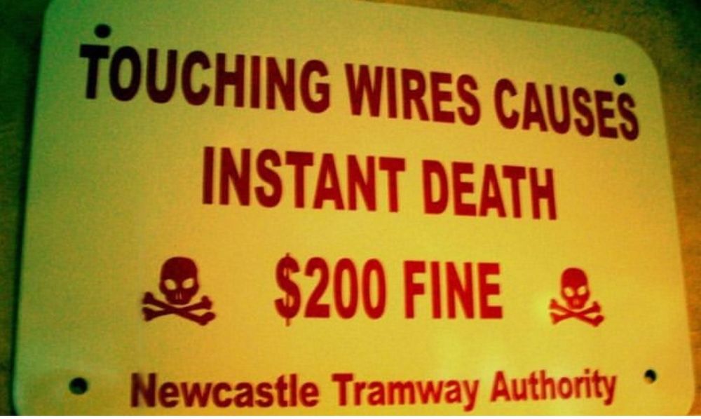 Sign saying: 
Touching wires causes instant death
$200 fine