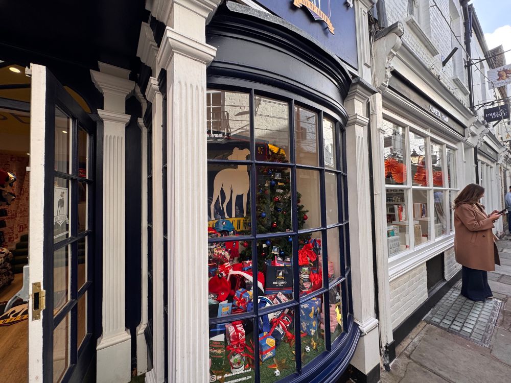 A Christmas tree behind the windows of the AFC Richmond shop (Ted Lasso).