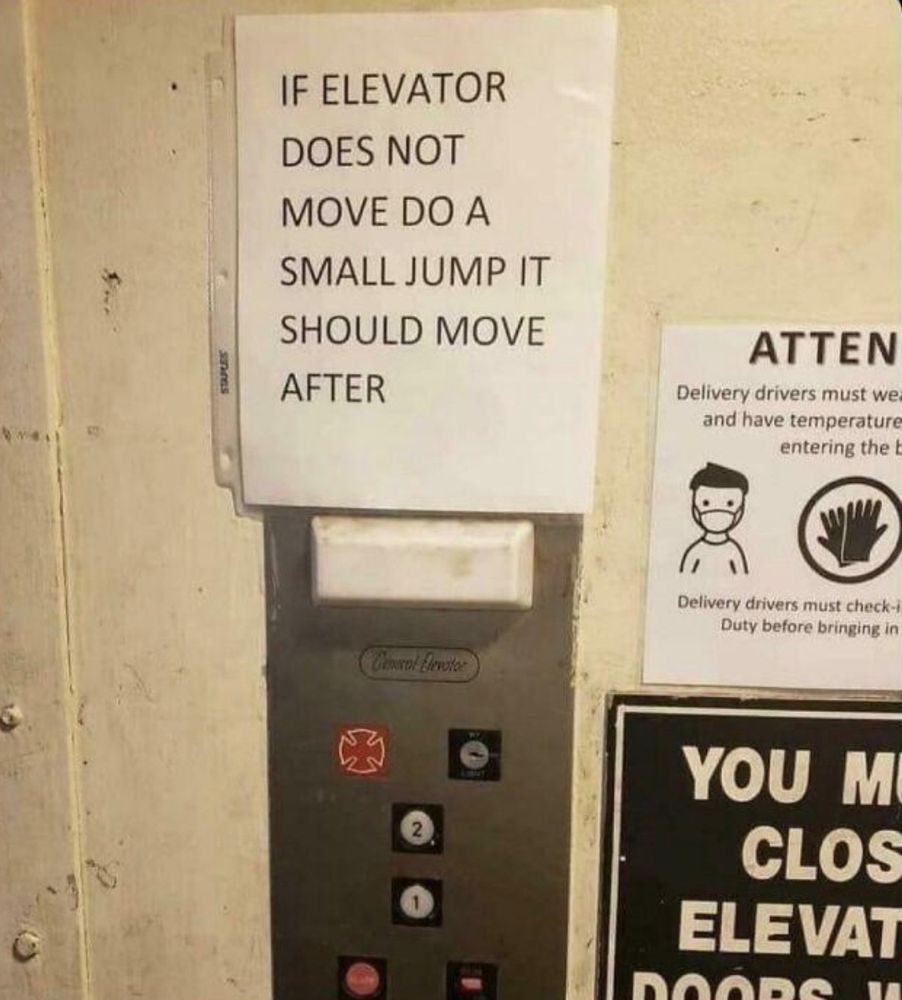 A sign in an elevator saying “If the elevator does not move. Do a small jump and it should move after that.”