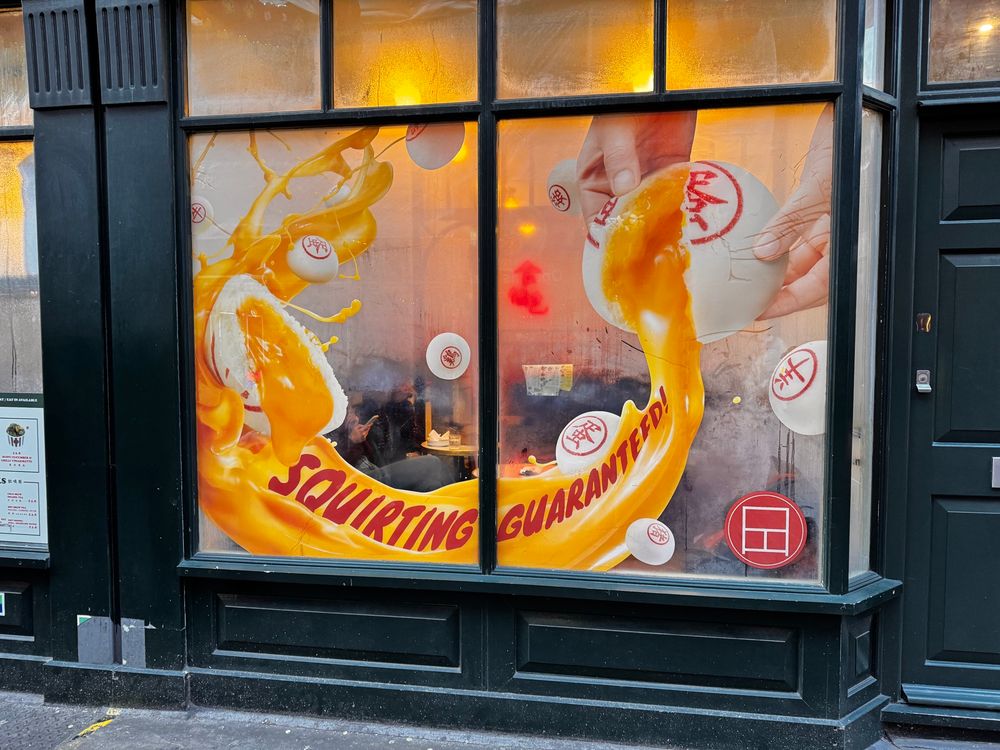 A Chinese restaurant with ‘squirting garanteed!’ written on the windows.