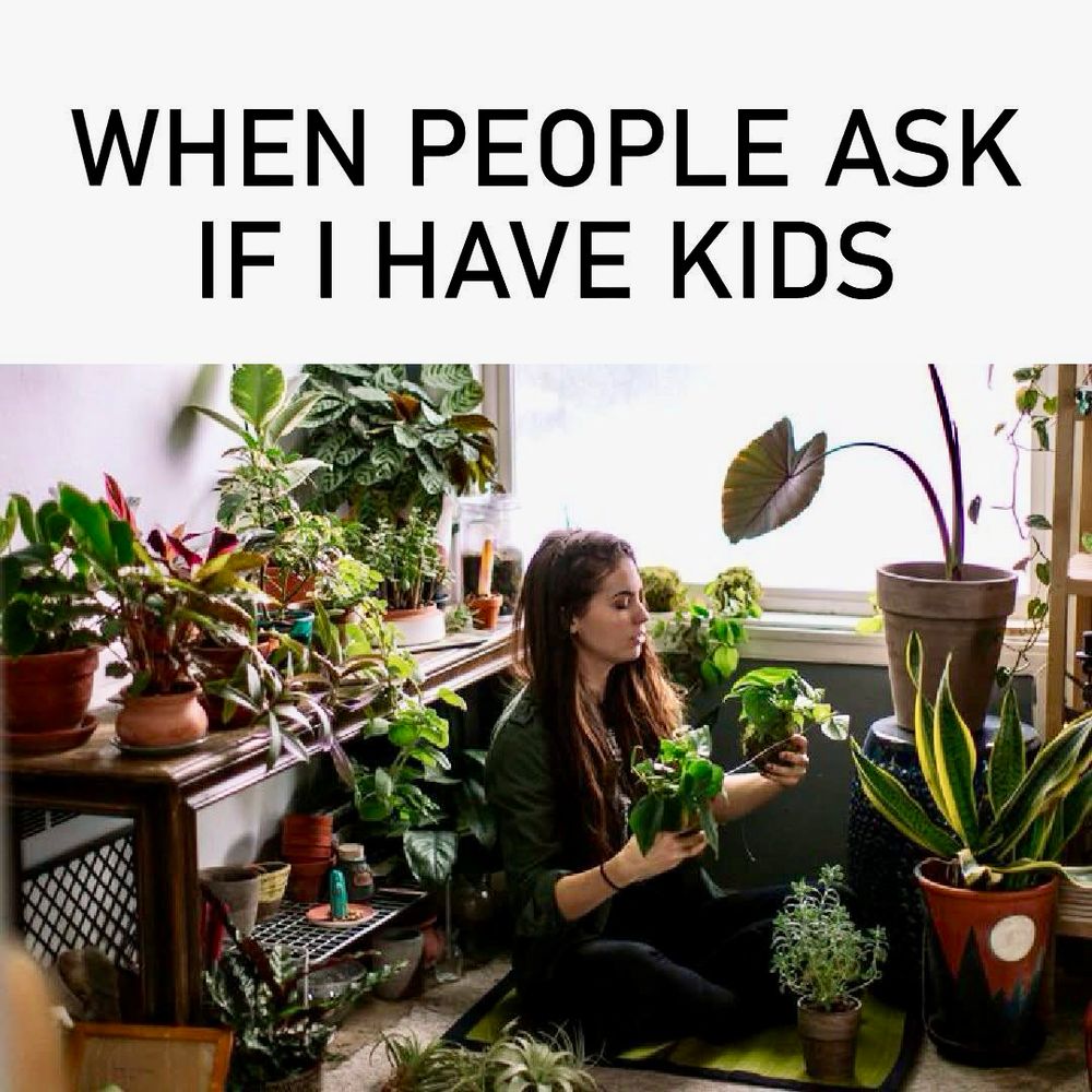 ‘When people ask if I have kids’
A woman surrounded by green plants.