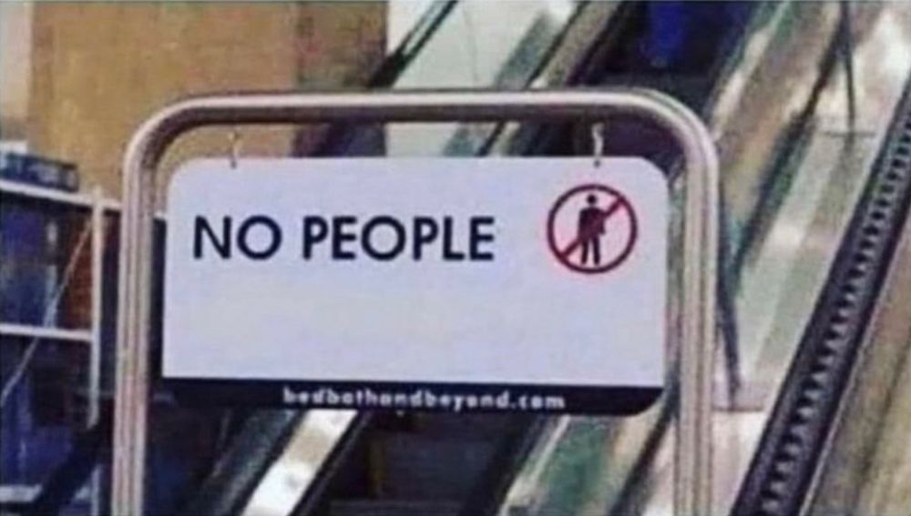 A sign in front of some escalator saying
“No people”
