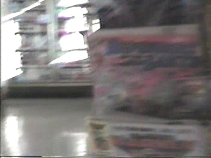 Blurry Screen Grab of a Comic Book spinner rack from a home movie