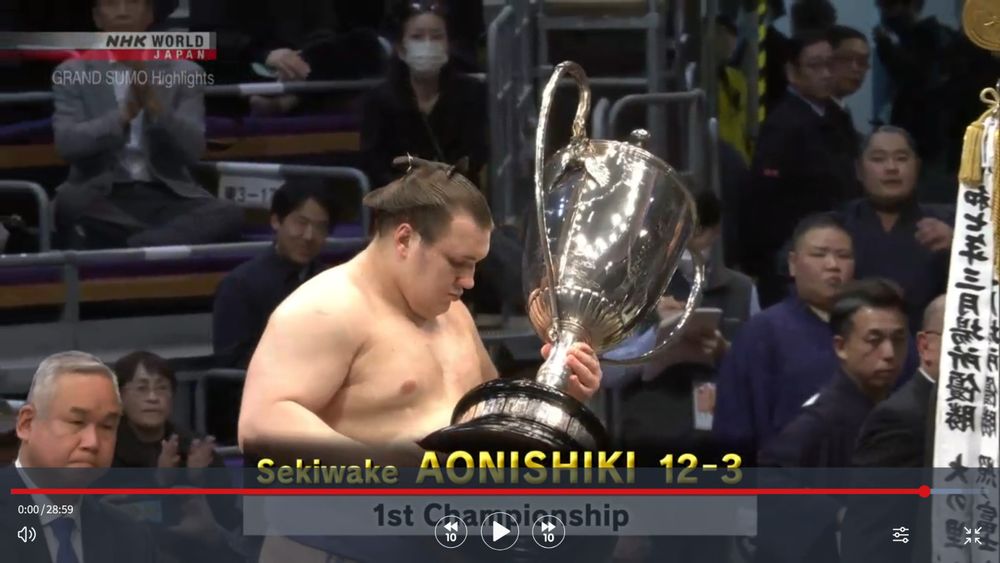 Screenshot. November 23, 2025. Ukrainian rikishi Aonishiki receives the Imperial Cup for his victory in the November sumo tournament, after defeating ozeki Kotozakura and yokozuna Hoshoryu, finishing with a score of 12-3.